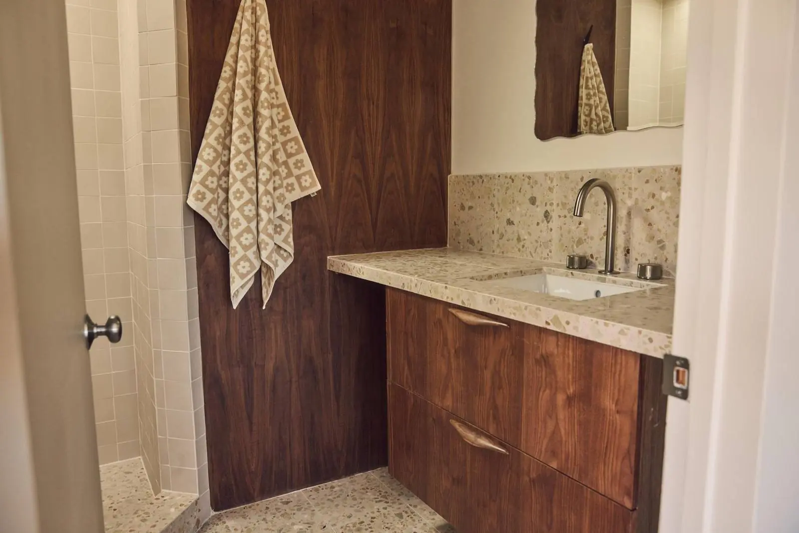Bathroom with a terrazzo counter and walnut cabinets, Ojai East End