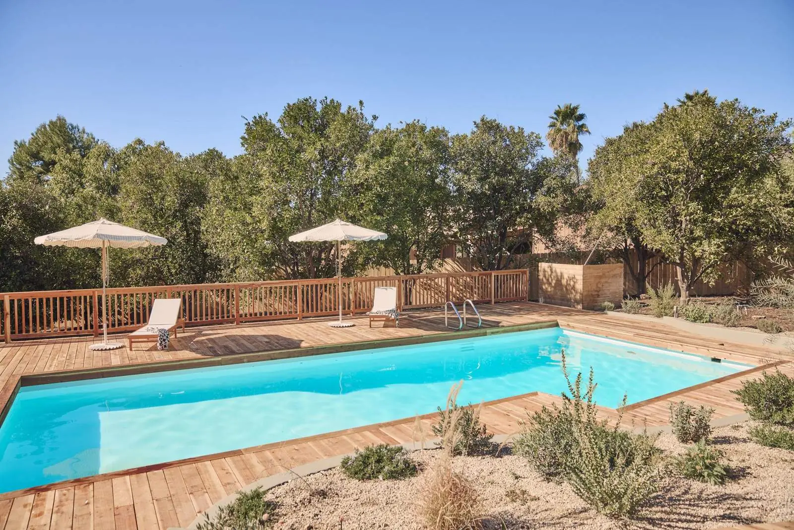 Pool and wood deck under oak trees, Ojai East End