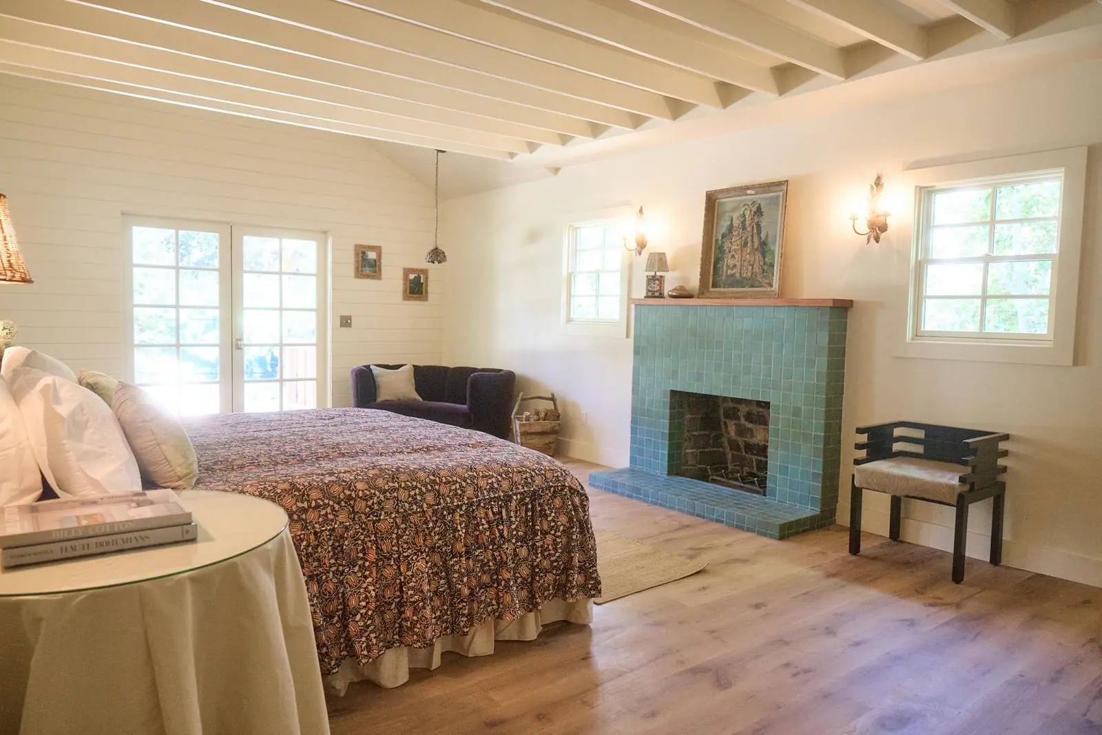 Bedroom with a green tiled fireplace, Ojai Gridley
