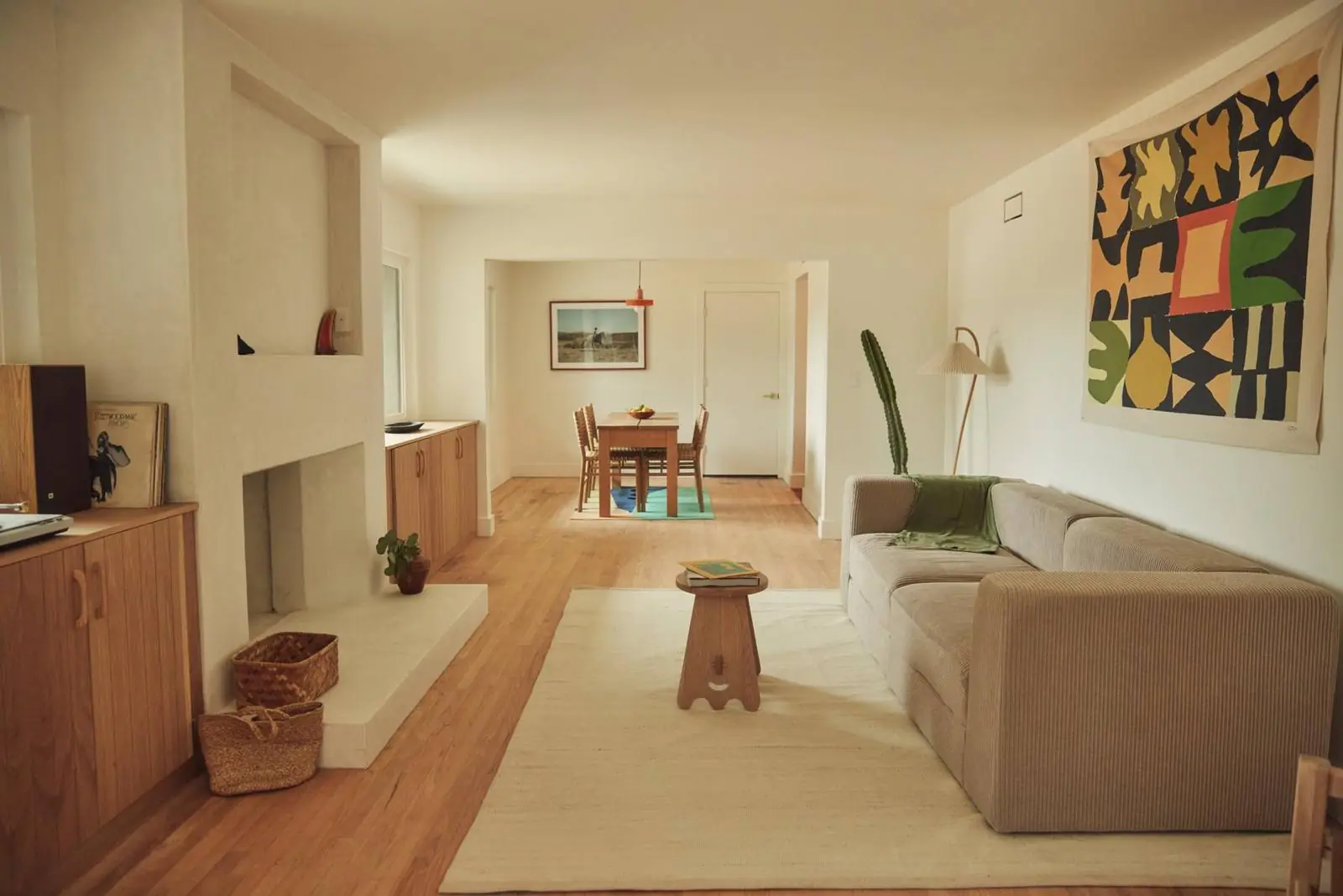 Living room with a plaster fireplace, Ojai Woodland
