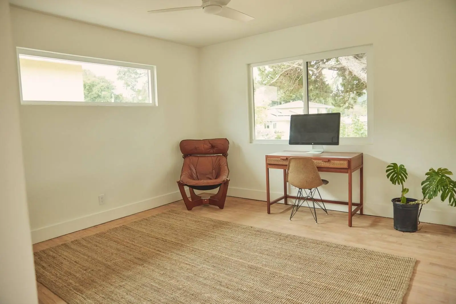 Bright home office with a desk under the window, Ojai Woodland