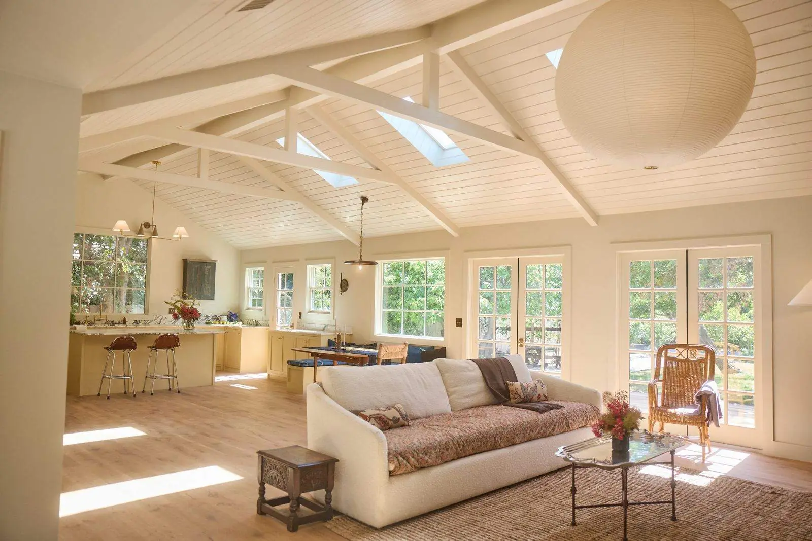 Ojai Gridley: a great room under a vaulted plank ceiling with skylights